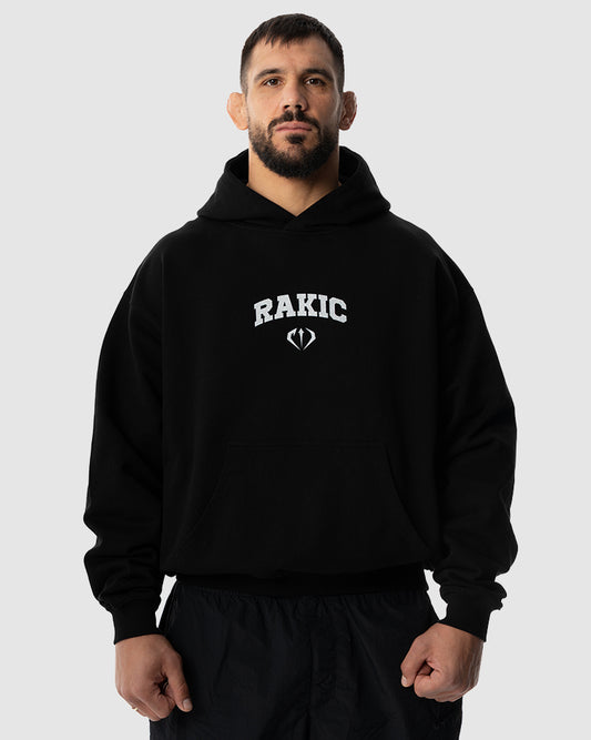 Aleksandar Rakic trägt das schwarze JUST DSRPT Premium Logo Hoodie